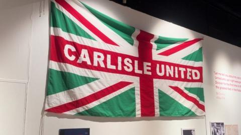 Carlisle United flag as a union flag but green red and white