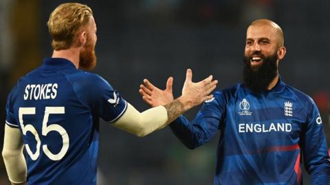 England players Ben Stokes (left) and Moeen Ali (right) high five