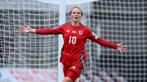 Wales midfielder Jess Fishlock celebrates scoring a goal against Kosovo