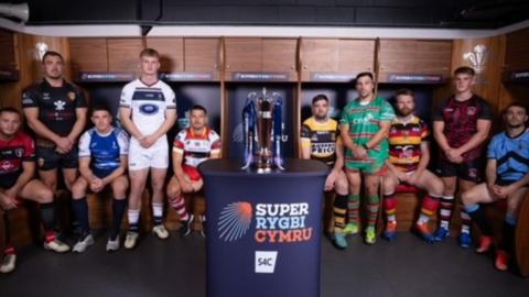 Representatives of 10 Super Rygbi Cyrmu teams with trophy