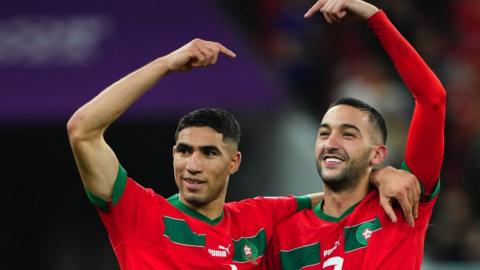 Achraf Hakimi and Hakim Ziyech celebrate a Morocco win at the World Cup