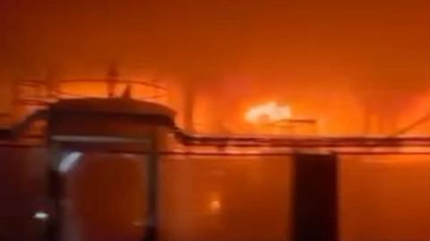Blurry image of industrial fire