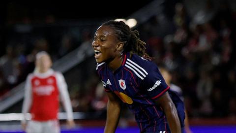 Melchie Dumornay celebrates