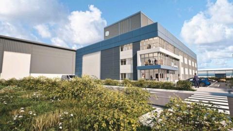 Computer generated image of how the main entrance building will look. It is a three storey office block with grey and white cladding. There is a zebra crossing across a road and some shrubs planted in the foreground.