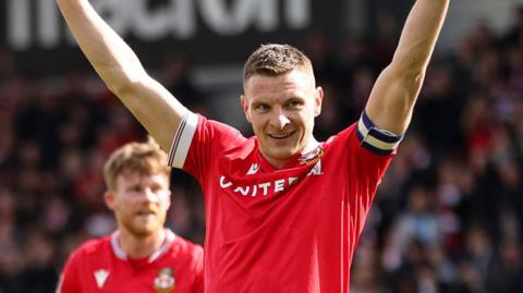 Paul Mullin celebrates scoring for Wrexham