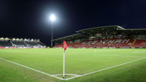 General view of the Racecourse Ground before an evening kick-off