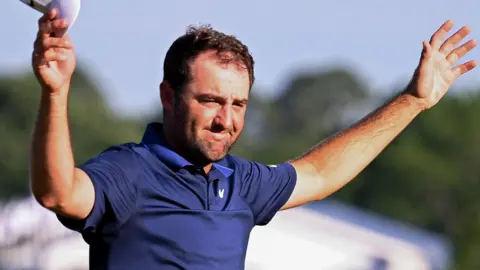 Scottie Scheffler celebrates after winning the US PGA Championship