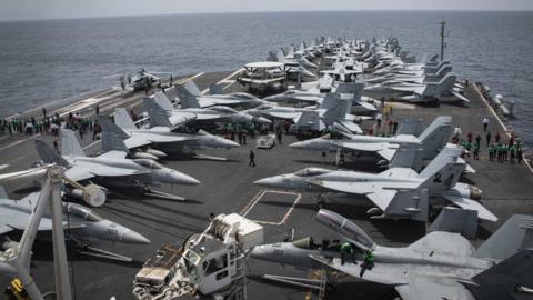 Handout photo from US Navy shows fighter jets on the deck of the USS Abraham Lincoln in the Arabian Sea on 19 May 2019