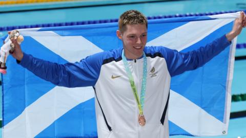 Duncan Scott with the Scottish flag