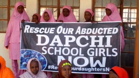 Schoolgirls wait for the arrival of Nigeria"s President Muhammadu Buhari at the Goverment girls" science and technical college in Dapchi, Nigeria March 14, 2018