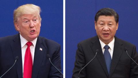 China's President Xi Jinping speaks next to US President Donald Trump during a business leaders event at the Great Hall of the People in Beijing on November 9, 2017.