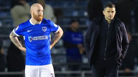 Portsmouth defender Connor Ogilvie and Portsmouth manager John Mousinho