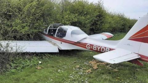 A plane in a hedge at Clacton Airfield, Esses