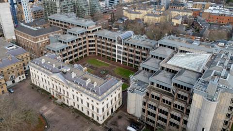 The Royal Mint site aerial view including many white buildings 