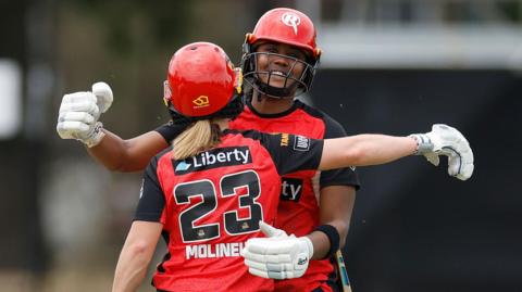 Hayley Matthews and Sophie Molineux of Melbourne Renegades celebrate beating Sydney Thunder