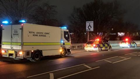 Emergency services dealing with discovery of grenade