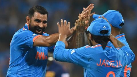 India players celebrate a wicket