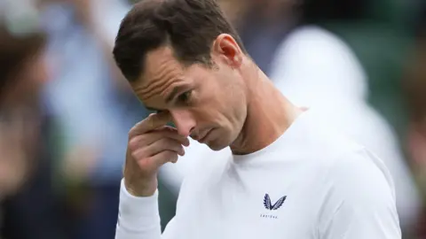 Andy Murray wipes away a tear