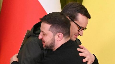 Ukraine's President Volodymyr Zelenskiy and Polish Prime Minister Mateusz Morawiecki hug