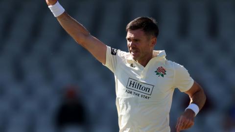 James Anderson raises his arm in celebration