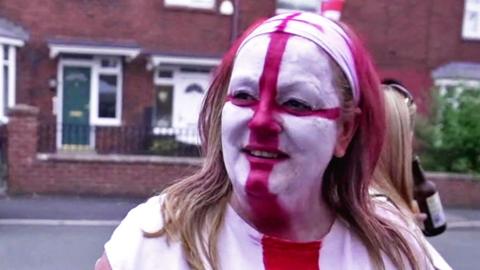 Woman with England flag face paint