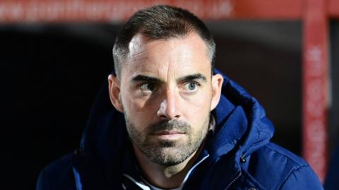 A tense looking Reading manager Ruben Selles on the touchline during a League One match.