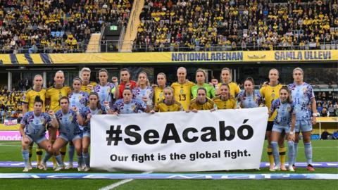 Spain and Sweden players stand together ahead of their Nations League match