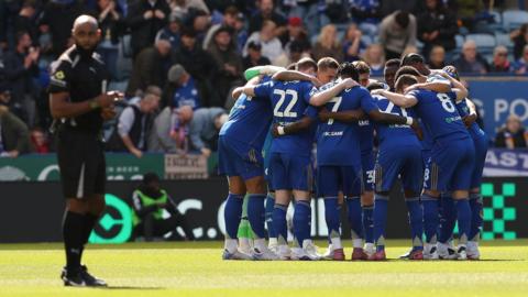 Leicester City player in a huddle
