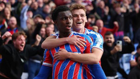 Eddie Nketiah celebrates scoring his team's second goal with teammate Justin Devenny