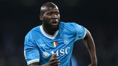 Romelu Lukaku running in a light blue Napoli shirt