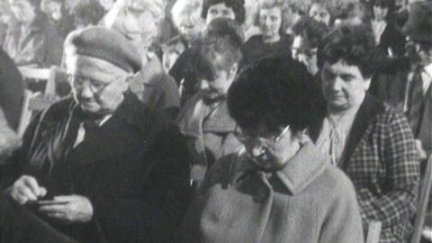 Women sitting in a crowded bingo hall