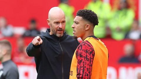 Erik ten Hag and Jadon Sancho on the touchline