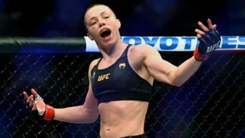 Rose Namajunas opens her arms celebrating