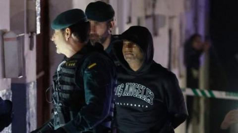 The confessed murderer of three brothers from Morata de Tajuna, Dilawar Hussein F.C. (R), is escorted by Spanish Civil Guard during a register in his home in Arganda del Rey, Madrid, Spain, 22 January 2024