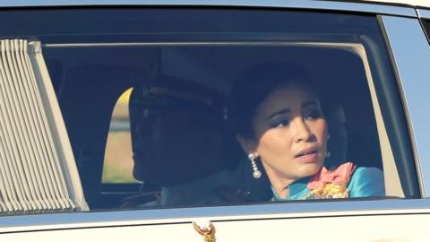Thailand's king and queen in a royal motorcade in Bangkok, Thailand October 14, 2020.