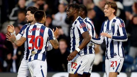 Isaac Price celebrates with his West Bromwich Albion team-mates after scoring