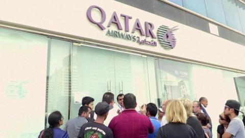 Passengers outside Qatar Airways office in Abu Dhabi, 6 June 2017