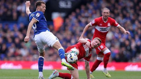 Kasey McAteer of Ipswich Town and Dael Fry of Middlesbrough challenge for a loose ball