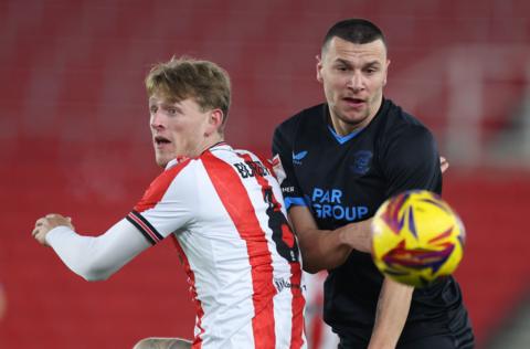 Milutin Osmajic and Wouter Burger competing for the ball