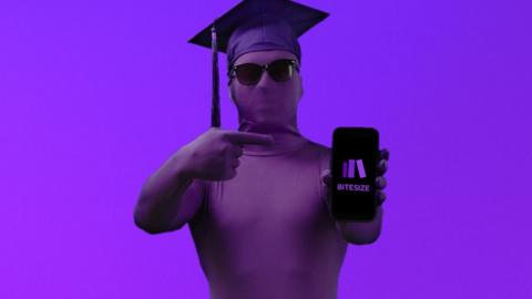Man wearing purple body suit with mortar board holding up and pointing to a phone with the BBC Bitesize logo on it.