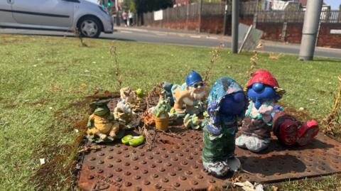 Broken garden ornaments in the middle of a roundabout