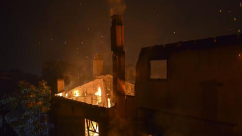 A burning building in Mati July 2018