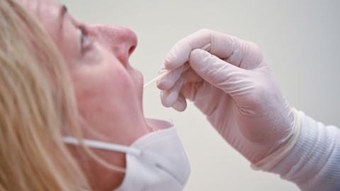 A woman having a rapid test