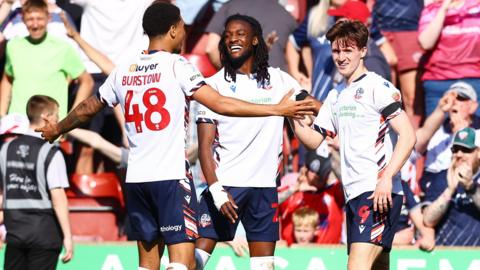 Bolton players celebrate their goal against Bradford