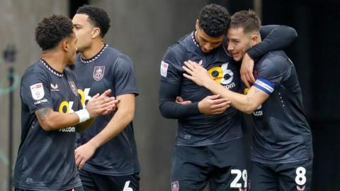 Burnley players celebrate their opening goal