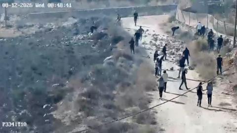 Settlers walk next to trees.