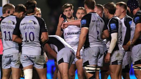 Newcastle Falcons gathered in a group discussion during the 43-10 loss to Sale Sharks