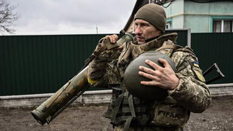 An Ukrainian soldier holds an anti-tank launcher north-east of Kyiv, Ukraine. Photo: 3 March 2022