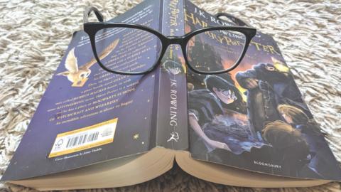 Harry Potter books and glasses