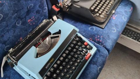 Typewriters on bus